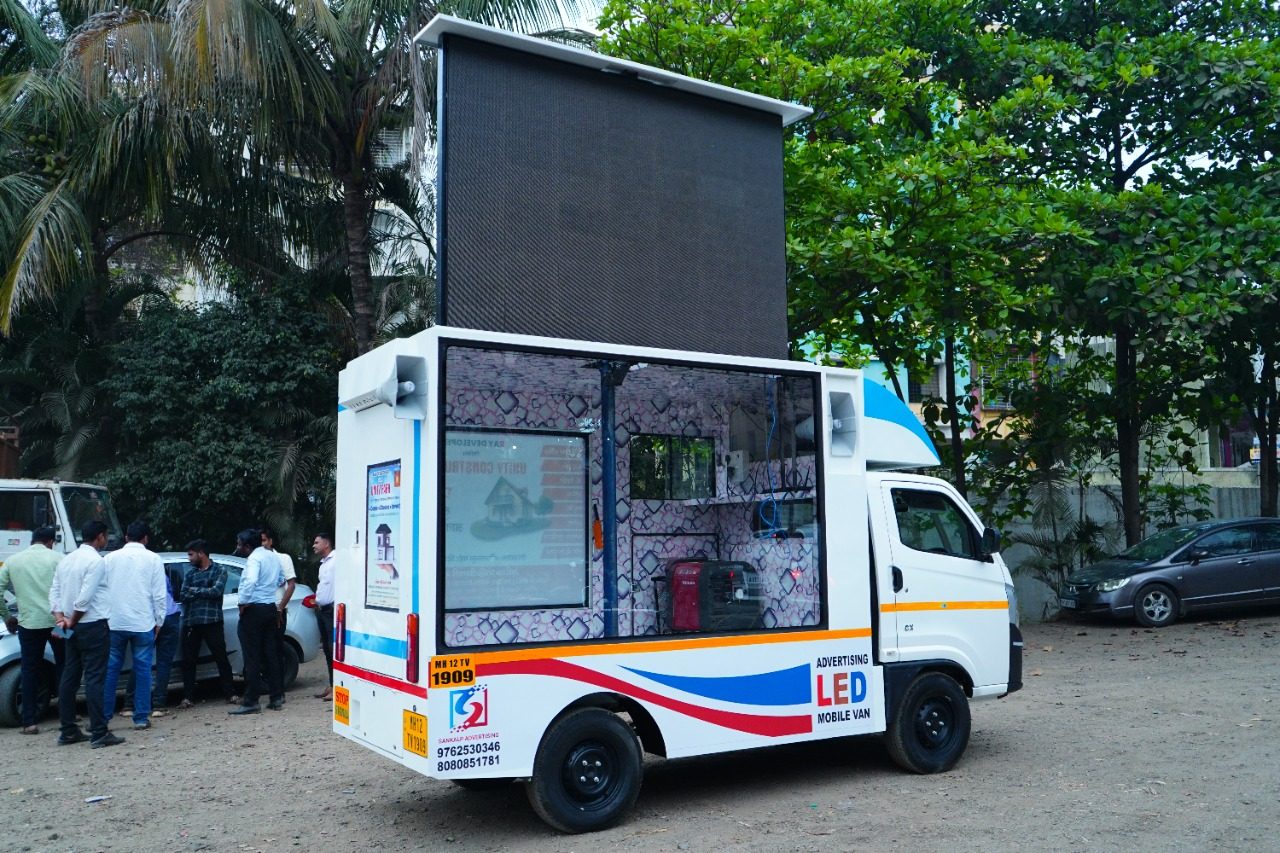 LED video van on rent displaying a bright advertisement at night